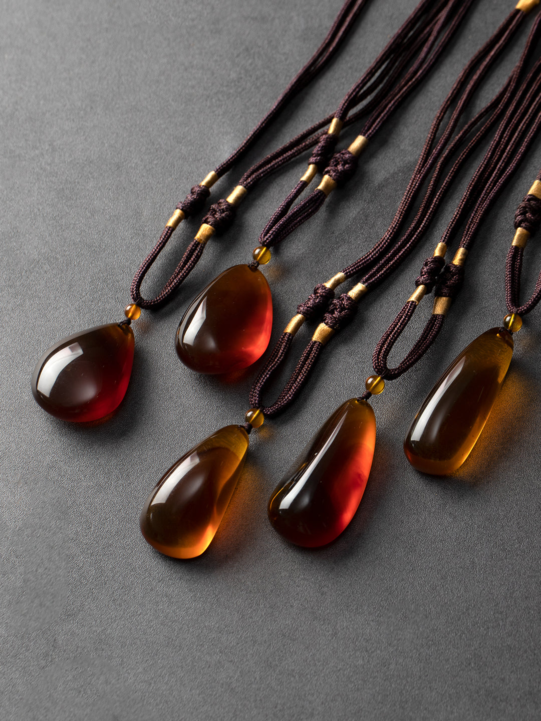 Authentic brownish-red freeform amber pendant with natural Myanmar amber, weighing 13 grams, from Your Brand.