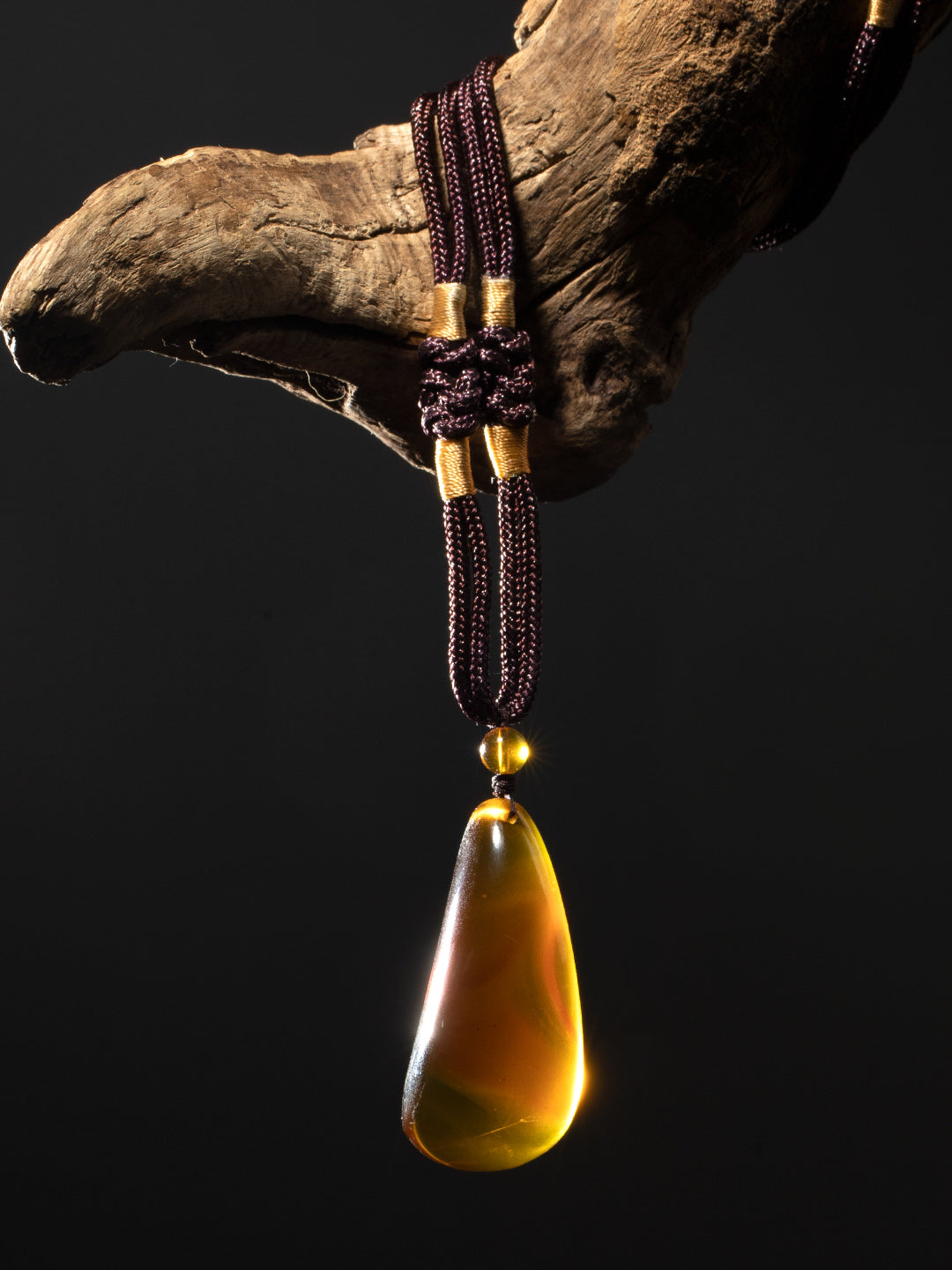 Authentic brownish-red freeform amber pendant with natural shape, weighing 13g, showcasing rich amber hues and organic design.