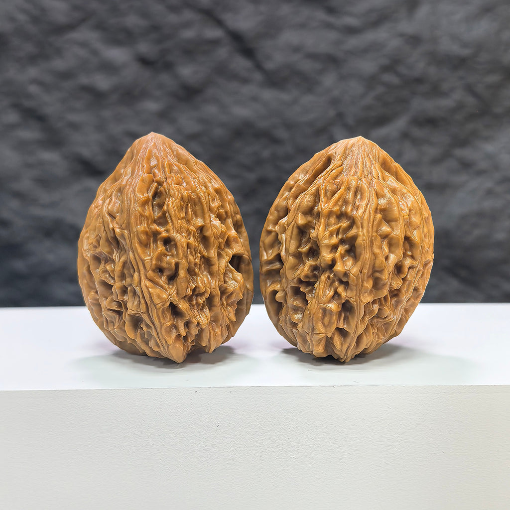 Pair of Beijing Chicken Heart Wenwan walnuts by Wenwan Art, 39mm, showcasing intricate natural wood grain and rich textures.