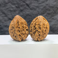 Pair of Beijing Chicken Heart Wenwan walnuts by Wenwan Art, 39mm, showcasing intricate natural wood grain and rich textures.