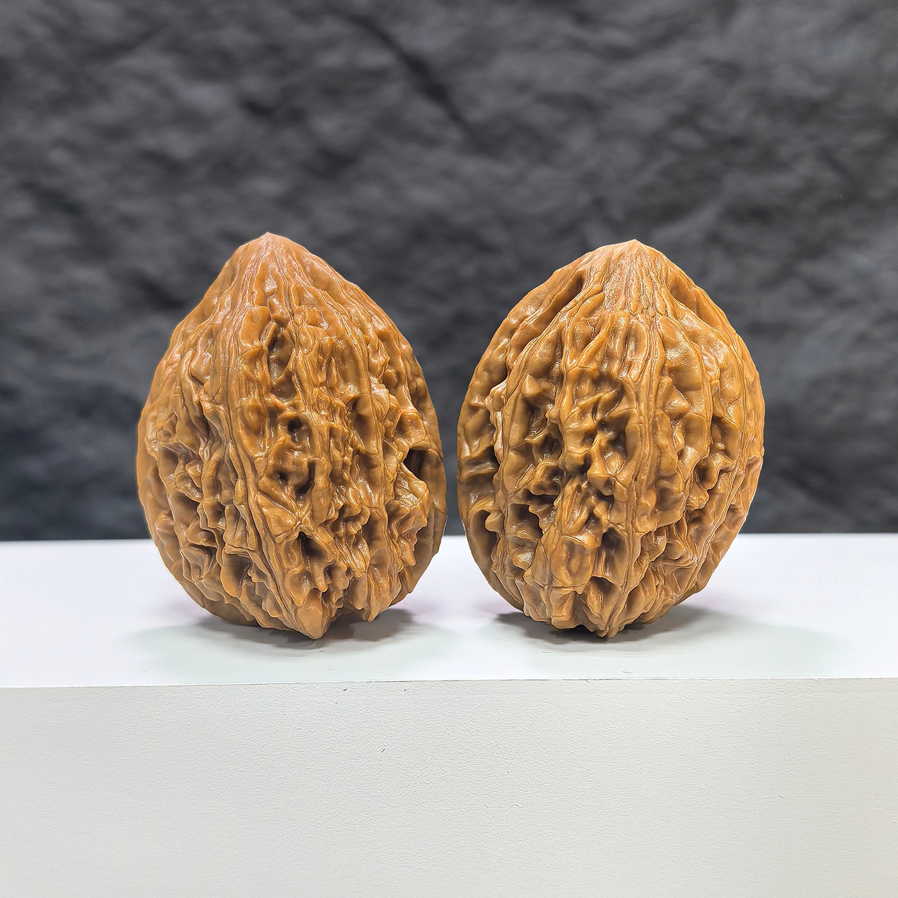 Pair of Beijing Chicken Heart Wenwan walnuts by Wenwan Art, 39mm, showcasing intricate natural wood grain and rich textures.
