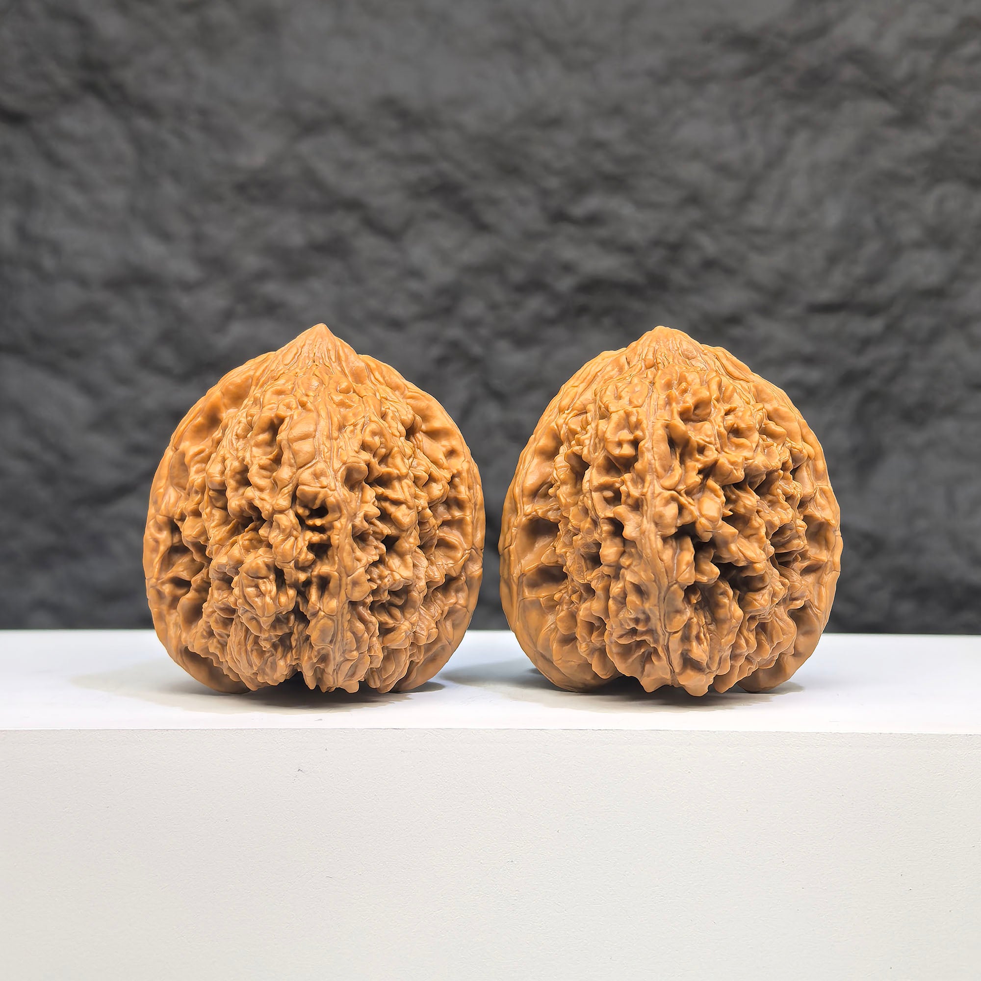 Pair of Peach Heart Concave Base Wenwan Walnuts with full star patterns, 40mm x 42mm, showcasing intricate craftsmanship.