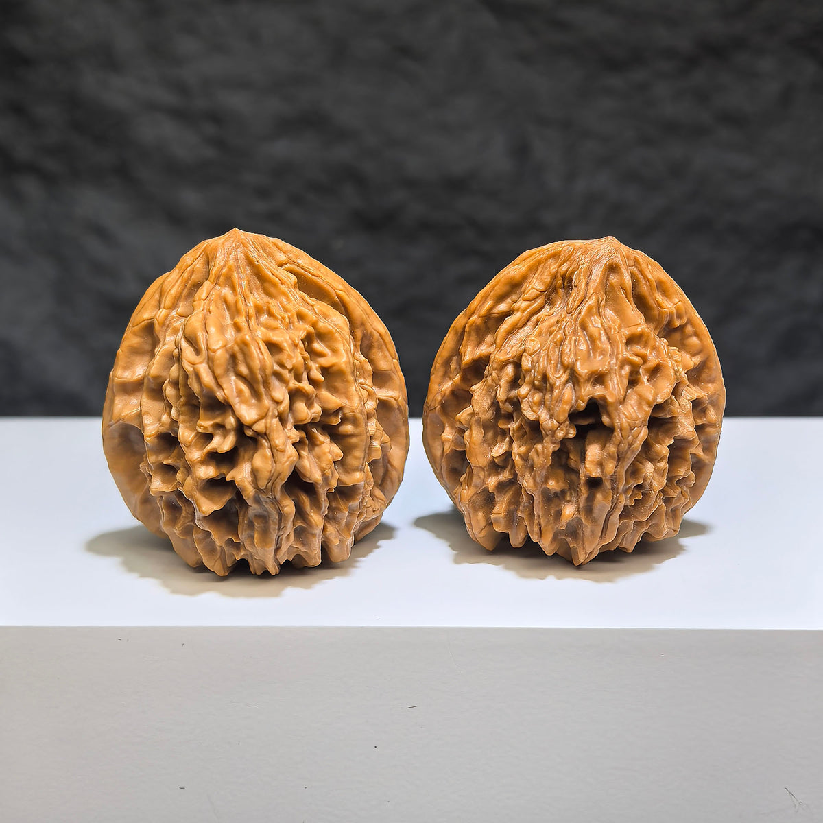 Pair of Tongtian Eight Classic Wenwan walnuts from Wenwan Art, featuring 36mm size and intricate natural wood grain details.
