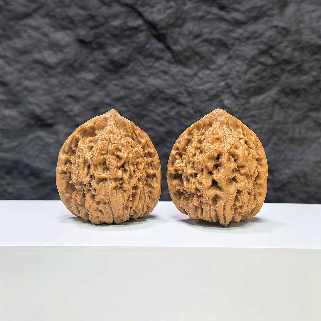 Pair of Kylin Texture Wenwan Walnut carvings by Wenwan Art, featuring 麒麟紋 pattern, 39mm x 35mm, detailed and textured surface.