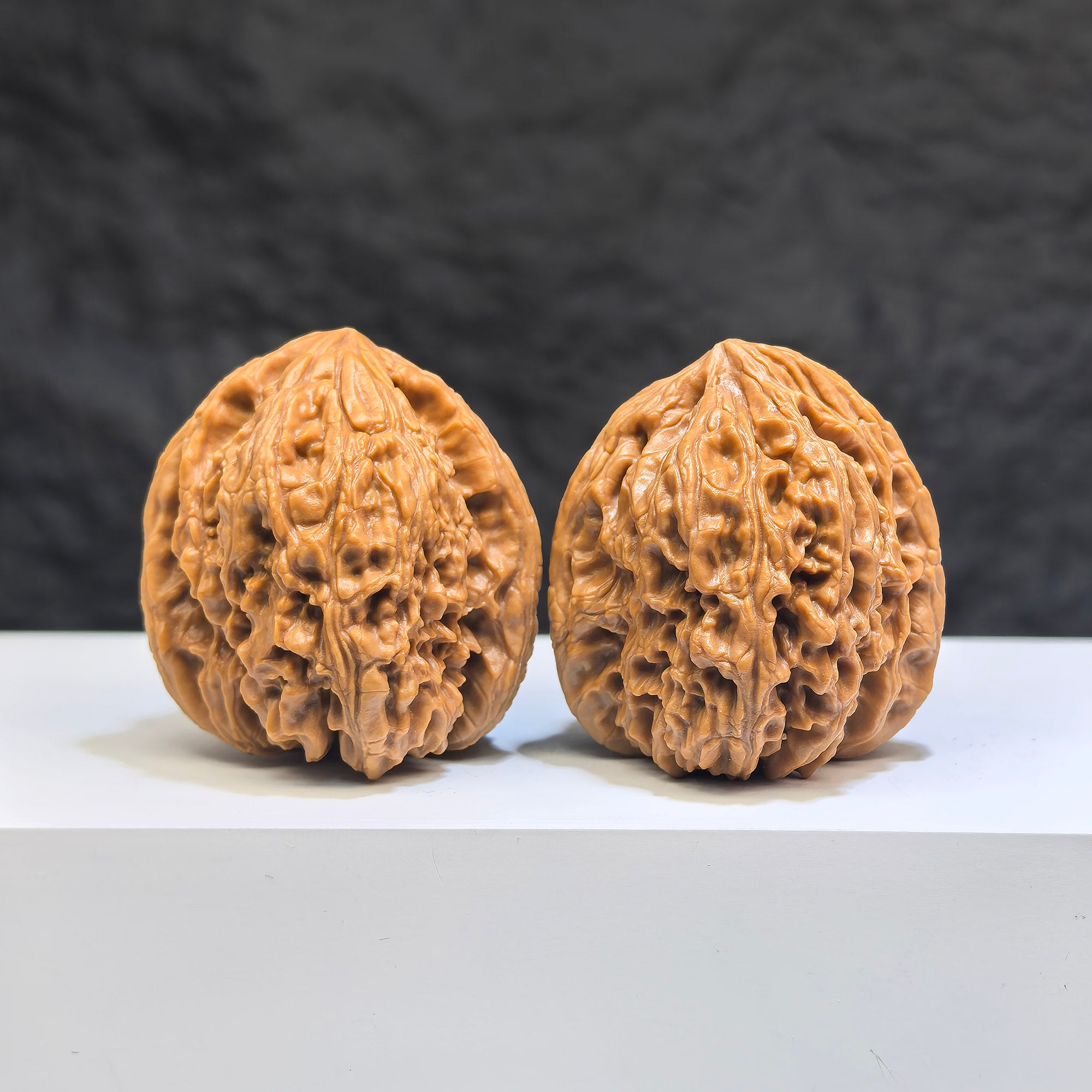 Pair of Nanjiangstone Wenwan walnuts from Wenwan Art, 36mm each, showcasing natural stone textures and detailed craftsmanship.