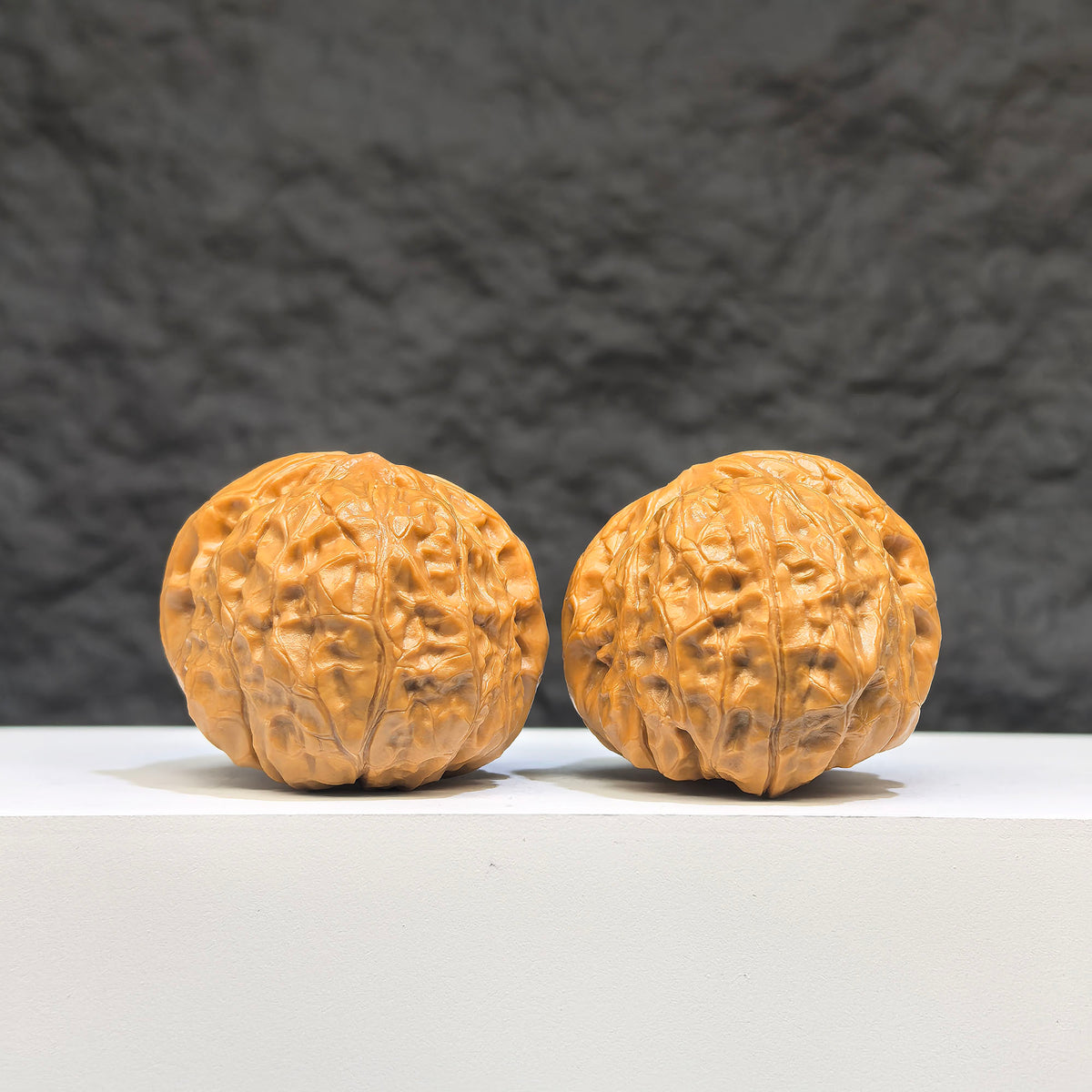 Miniature Wenwan Walnut pair with small pumpkin design, crafted by Wenwan Art, measuring 38x40mm, detailed and polished.
