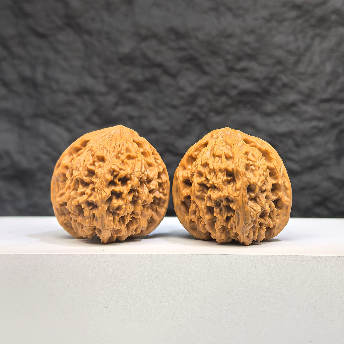 Pair of spherical Wenwan Art full star Wenwan walnuts, round profile, 38mm, featuring intricate star patterns on smooth surface.