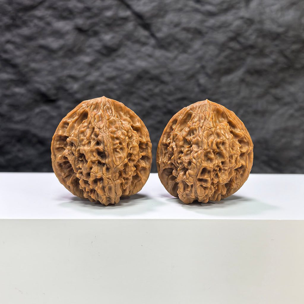 Pair of Golden Kylin Wenwan Walnut carvings by Wenwan Art, 37mm, featuring detailed golden kylin motifs on smooth walnut surfaces.