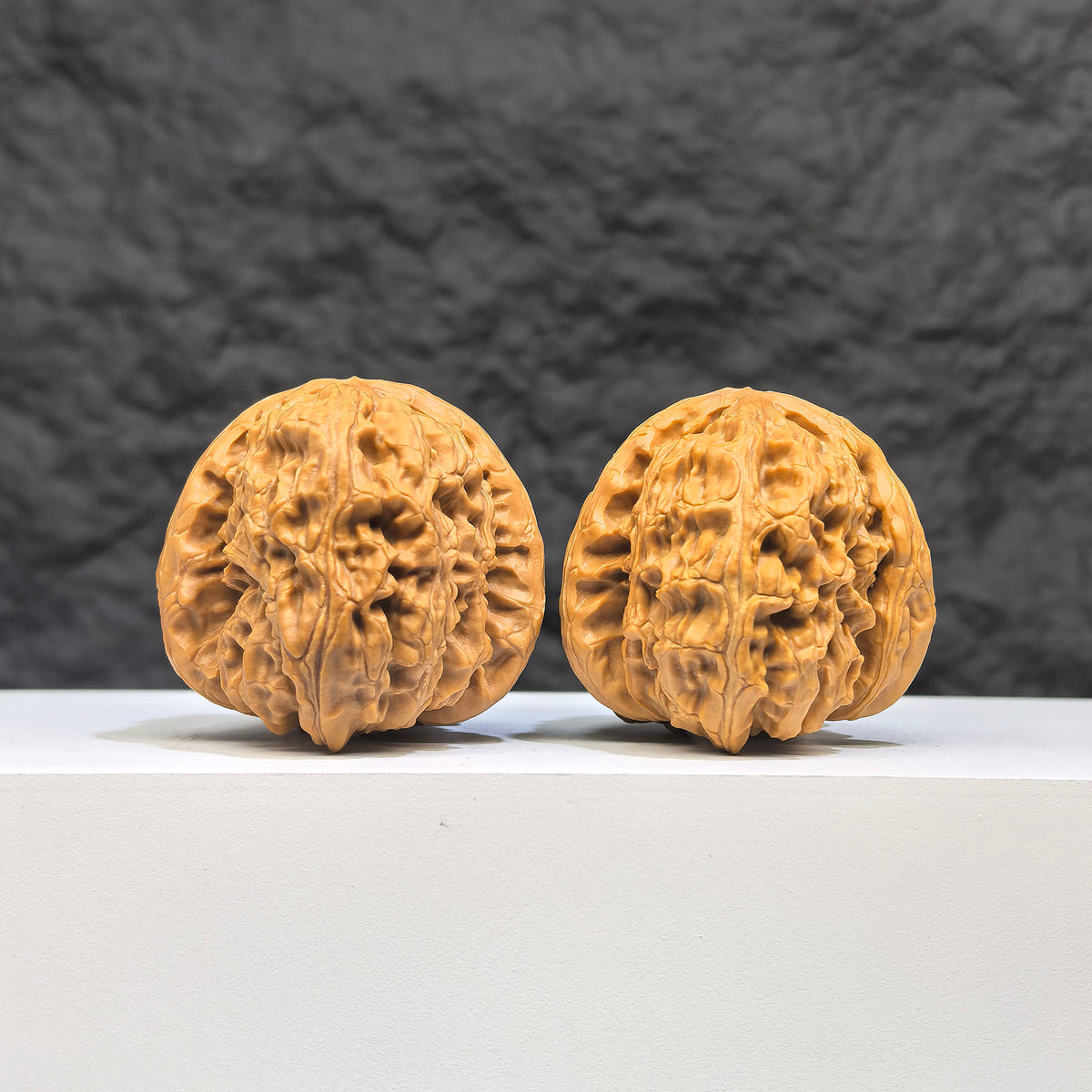 White Lion Wenwan Walnut pair from Wenwan Art, featuring detailed carvings, measuring 36mm x 39mm, showcasing craftsmanship.