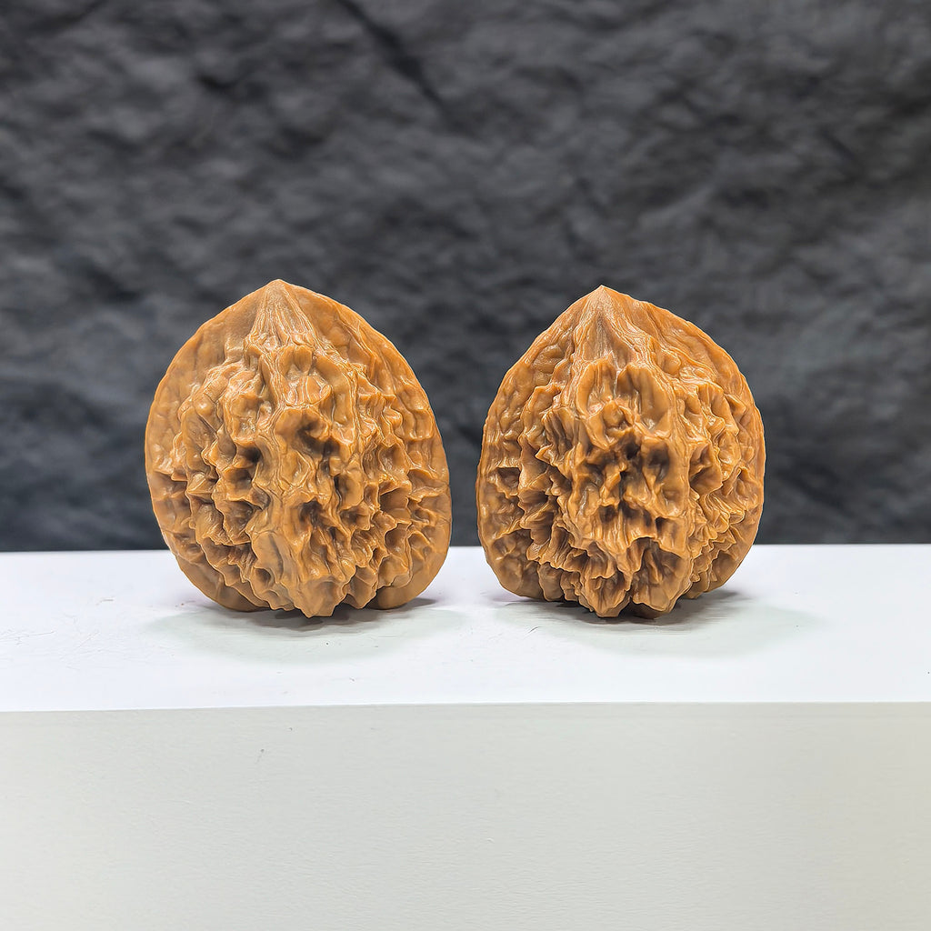 Pair of Dragon Scale Wenwan Walnuts by Wenwan Art, 36mm, featuring intricate dragon scale patterns on polished walnut surfaces.