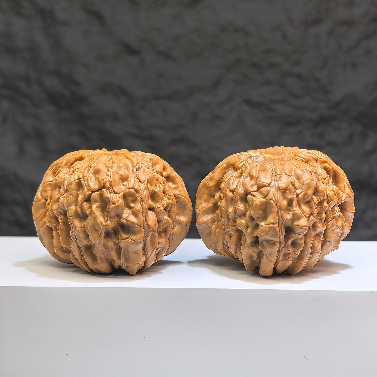 Pair of Huakun Dragon Dragon-Scale Wenwan Walnuts by Wenwan Art, featuring intricate dragon-scale patterns, size 49x51mm.