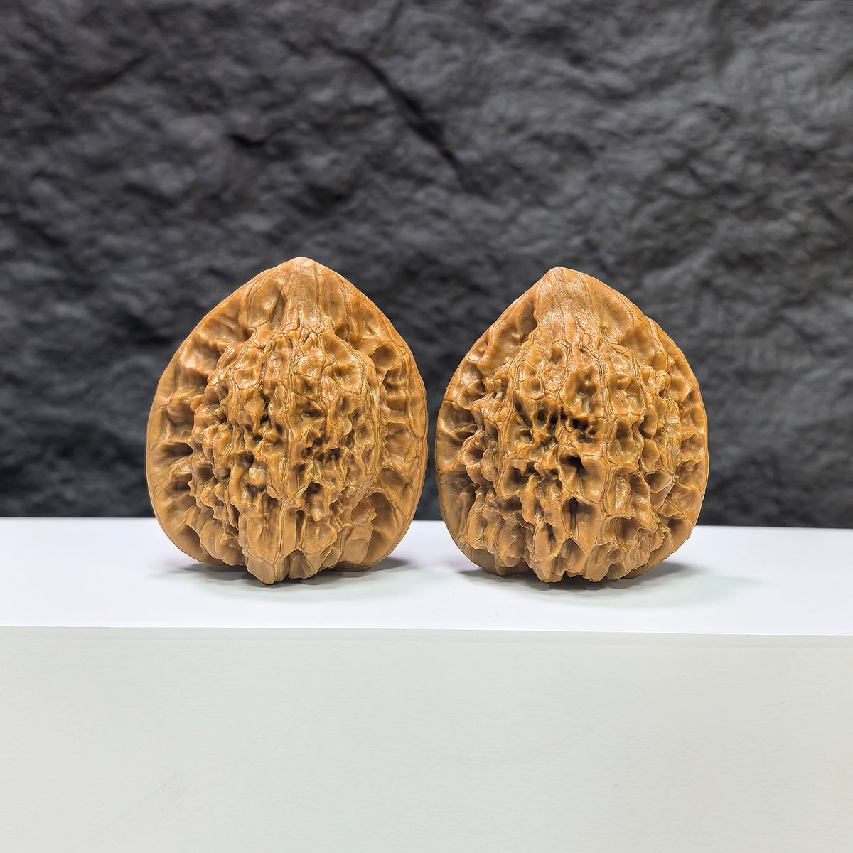 Wenwan Art official classic Wenwan walnuts pair, 43mm x 37mm, featuring detailed carved wood patterns and natural walnut color.