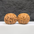 Miniature Wenwan Walnuts pair with symmetrical millstone design by Wenwan Art, measuring 36mm x 33mm.
