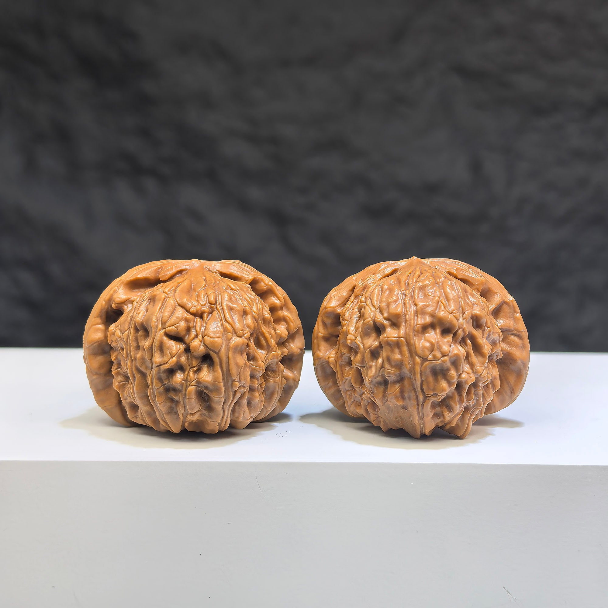 Pair of Pocket Spherical White Lion Wenwan Walnuts from Wenwan Art, 35mm round-profile decorative walnuts featuring white lion carvings.