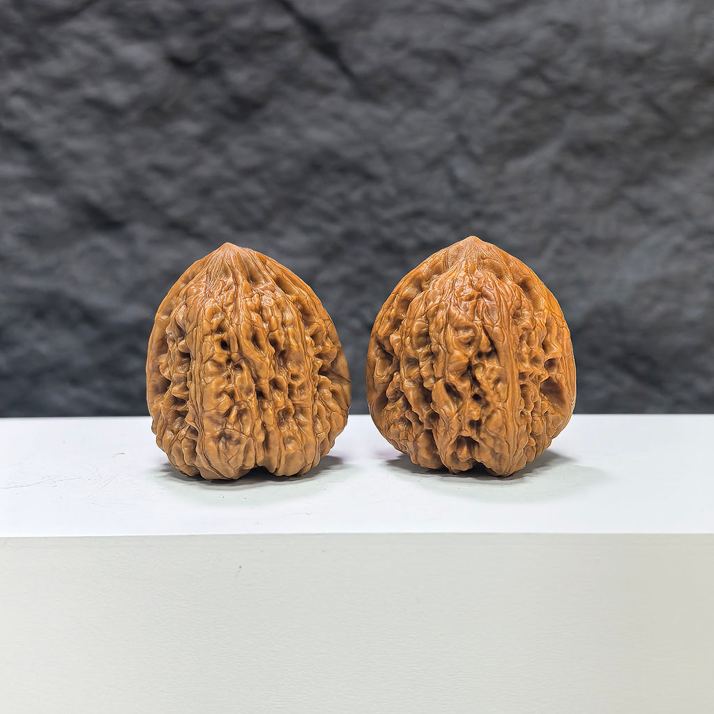Pair of Pinggu Concave Base Wenwan walnuts from Wenwan Art, deep-base walnut pair with 33.0mm x 37.0mm dimensions.