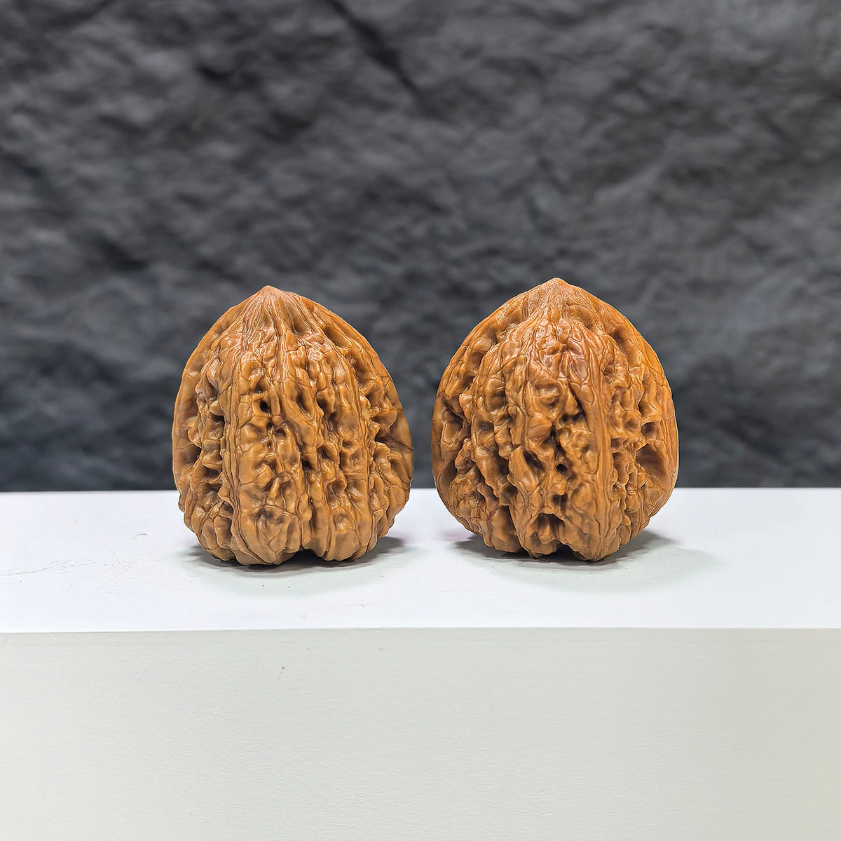 Pair of Pinggu Concave Base Wenwan walnuts from Wenwan Art, deep-base walnut pair with 33.0mm x 37.0mm dimensions.