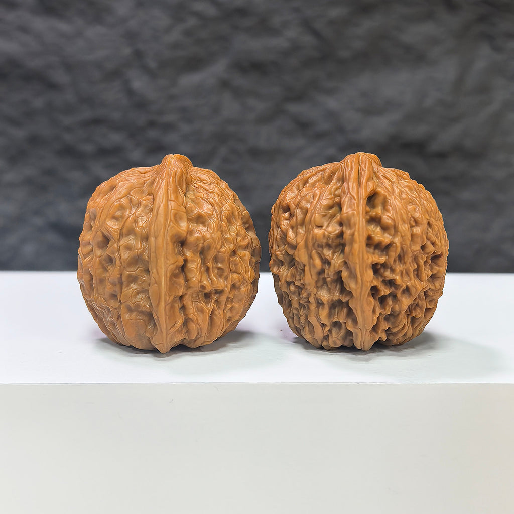Miniature Wenwan Walnut pair with meteorite inclusions, crafted by Wenwan Art, measuring 31mm x 31mm, showcasing unique natural textures.