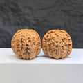 Pair of White Lion Wenwan Walnuts by Wenwan Art, 36mm classic Chinese collectible walnut carvings, detailed white lion designs.