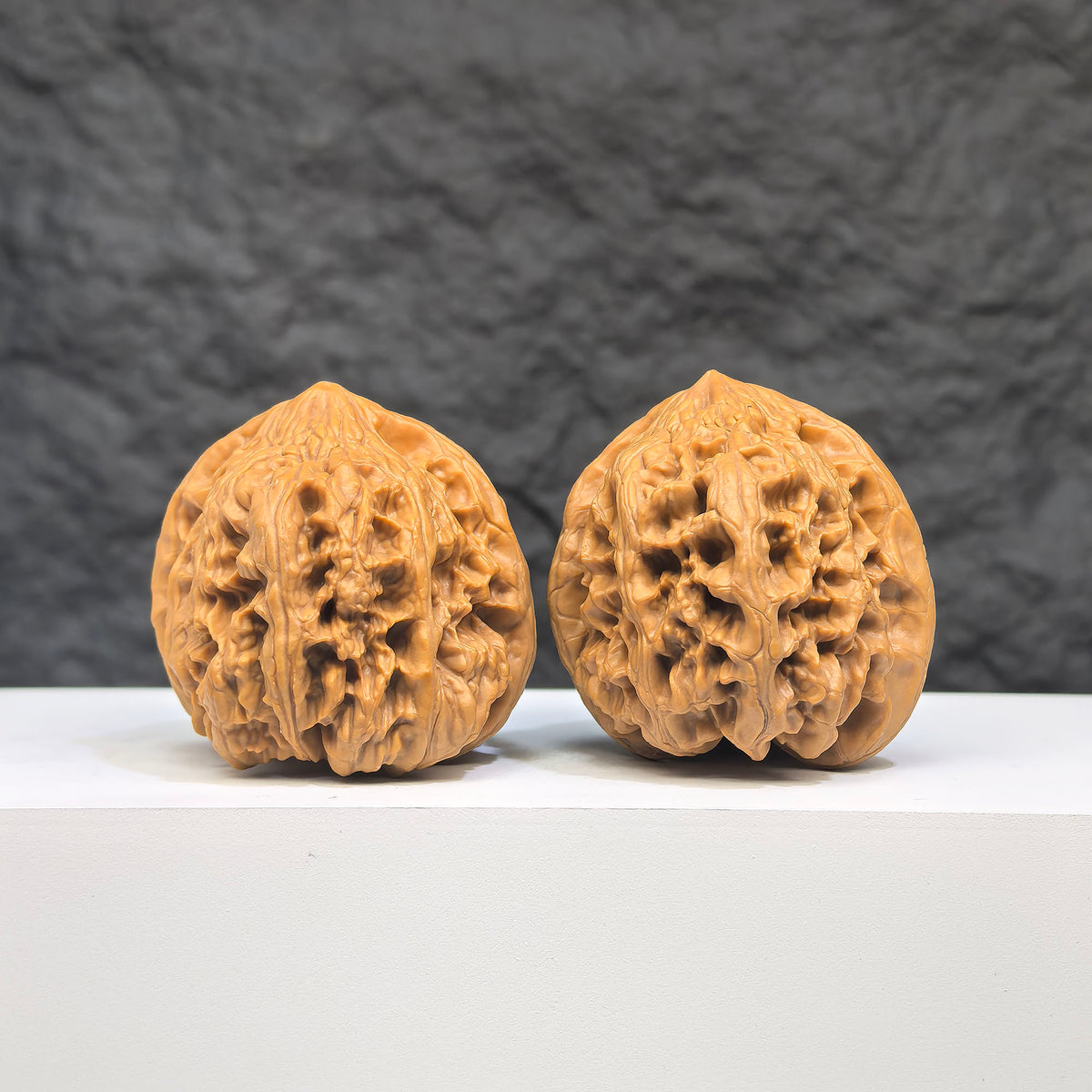 Selected grade Wild Bison Walnut Wenwan Art piece, 4cm by 4cm, featuring intricate natural wood grain and smooth polished surface.