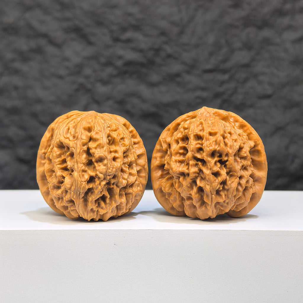 Yuhua Stone Wenwan walnut pair from Wenwan Art, 37mm x 34mm, featuring intricate natural stone patterns and smooth polished surfaces.