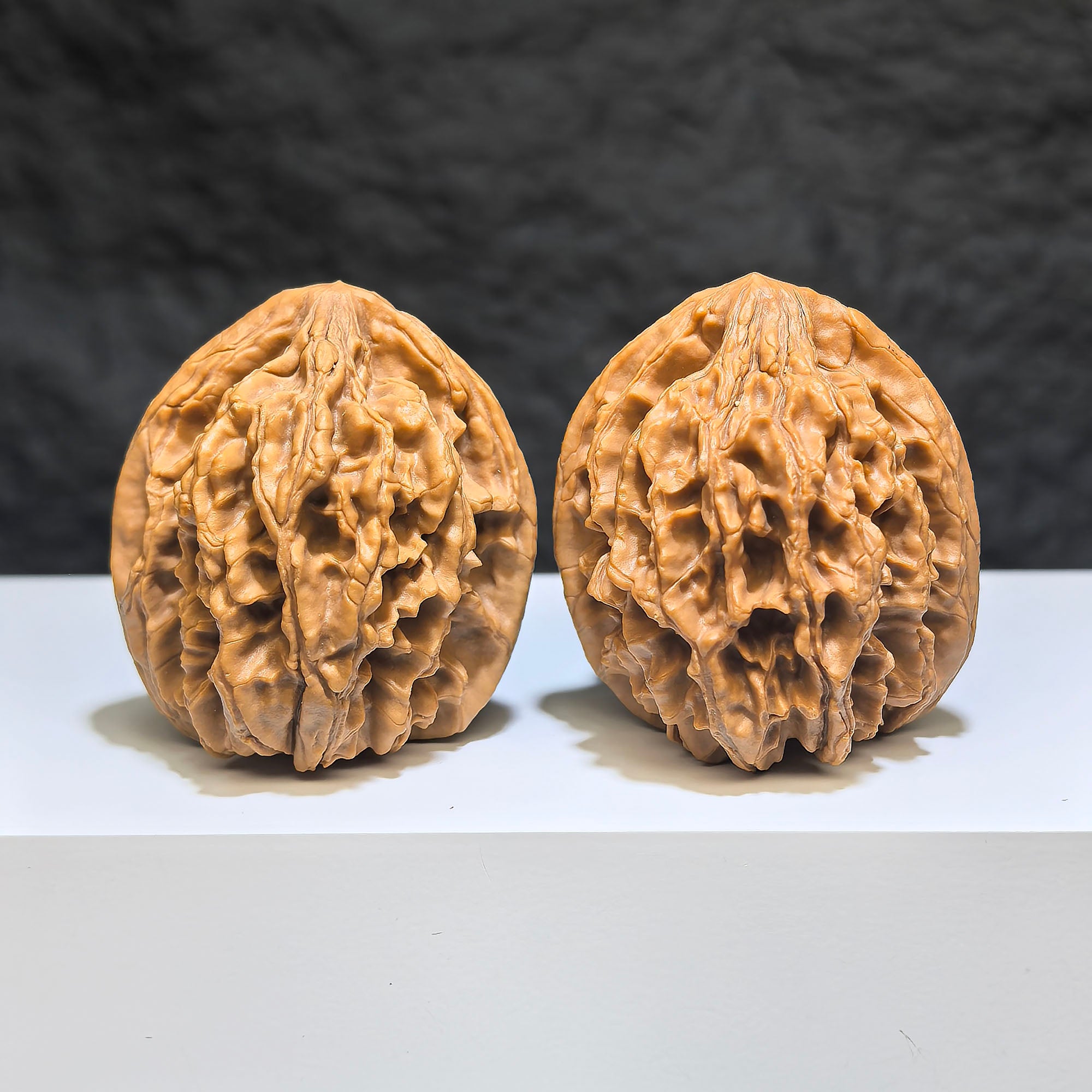 Wenwan Art "Tongtian Eight" classic Wenwan walnuts pair, 40mm x 37mm, showing smooth, polished walnut shells with intricate patterns.