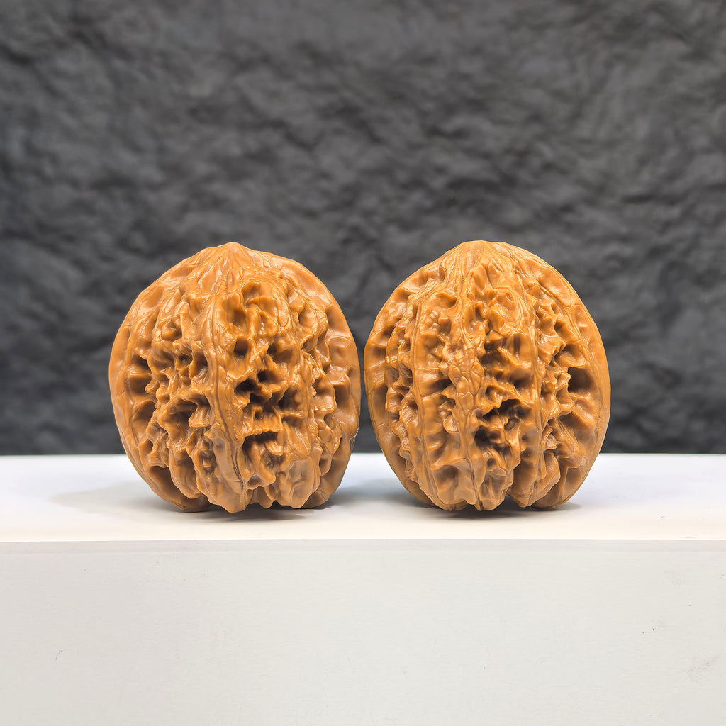 Selected grade Wild Bison Walnut from Wenwan Art, measuring 3.8cm, with smooth, polished surface and natural wood grain details.