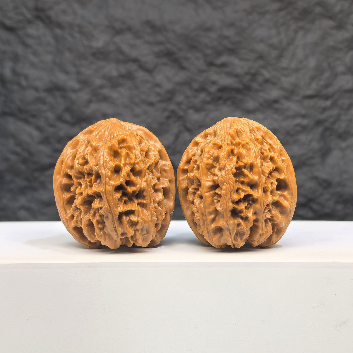 Selected grade Wild Bison Walnut from Wenwan Art, measuring 3.8cm, with smooth, polished surface and natural wood grain details.
