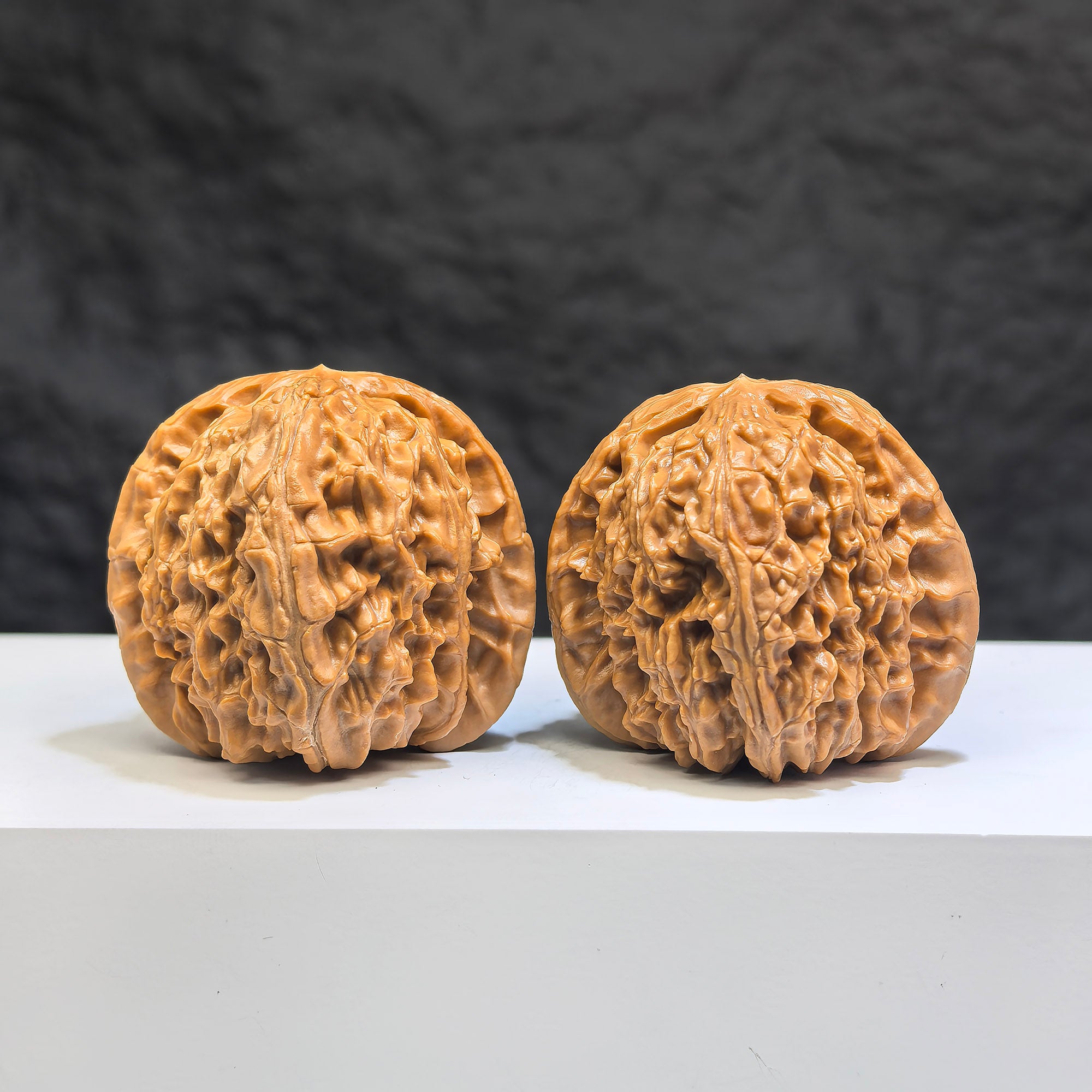 Pair of White Lion Wenwan Walnuts by Wenwan Art, 39mm, featuring intricate white lion carvings on polished walnut surfaces.