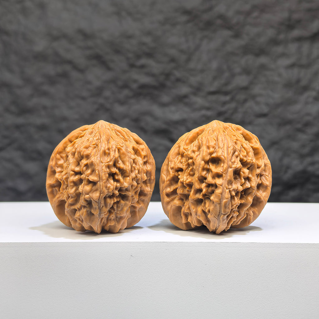 Pair of Wenwan Art Millstone Classic Wenwan walnuts, 38mm x 37mm, featuring detailed carvings and traditional design.