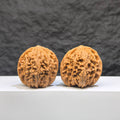Pair of Wenwan Art Millstone Classic Wenwan walnuts, 38mm x 37mm, featuring detailed carvings and traditional design.