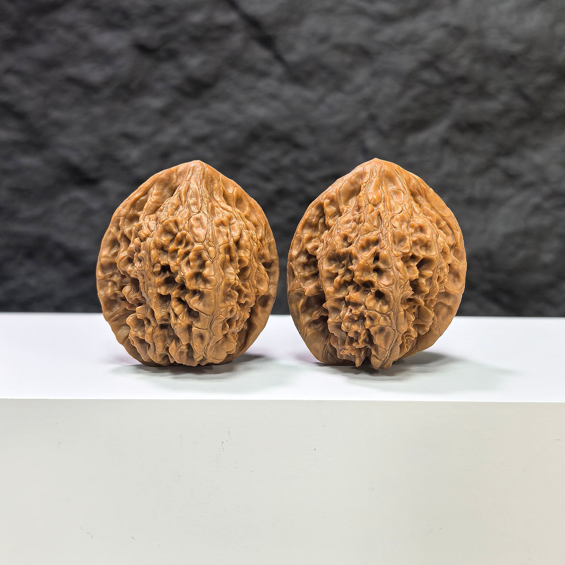 Golden Kylin Classic Wenwan Walnut pair by Wenwan Art, 36mm x 37mm, showcasing detailed carved walnut art and natural wood grain.