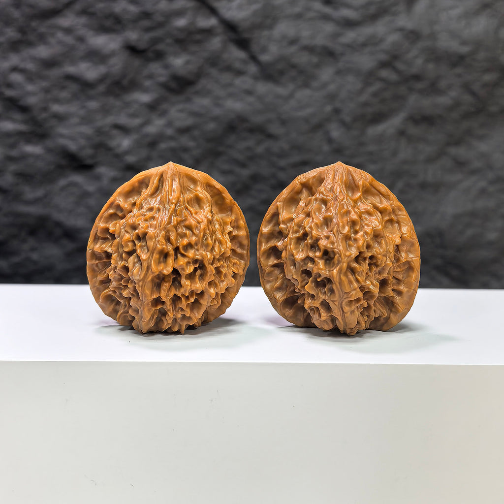 Pair of Golden Kylin Wenwan walnuts from Wenwan Art, featuring 37x38mm classic carved walnut art pieces.