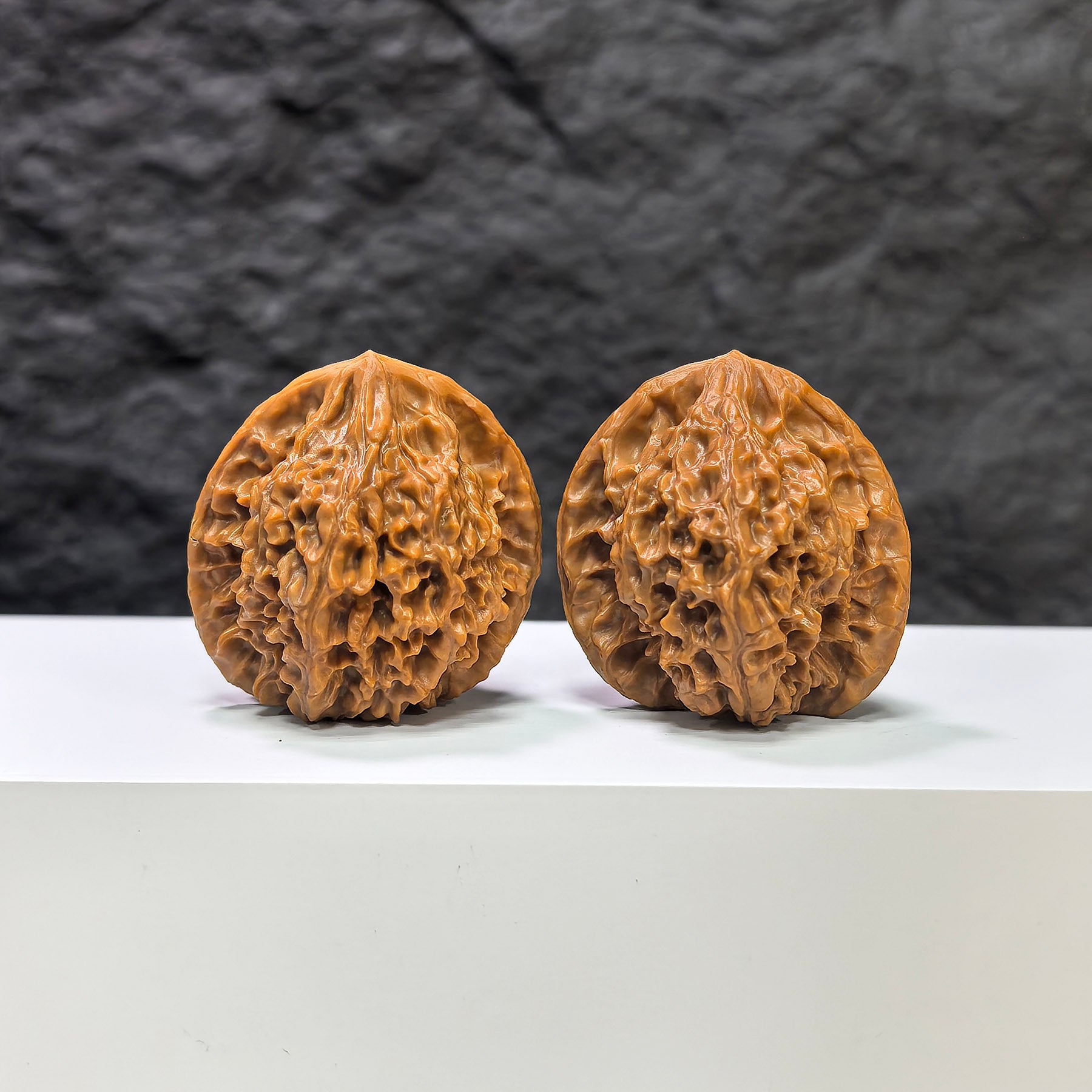 Pair of Golden Kylin Wenwan walnuts from Wenwan Art, featuring 37x38mm classic carved walnut art pieces.