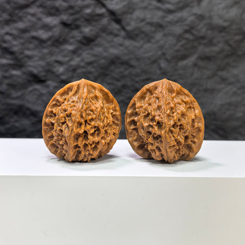 Pair of Golden Kylin Wenwan walnuts from Wenwan Art, featuring 37x38mm classic carved walnut art pieces.