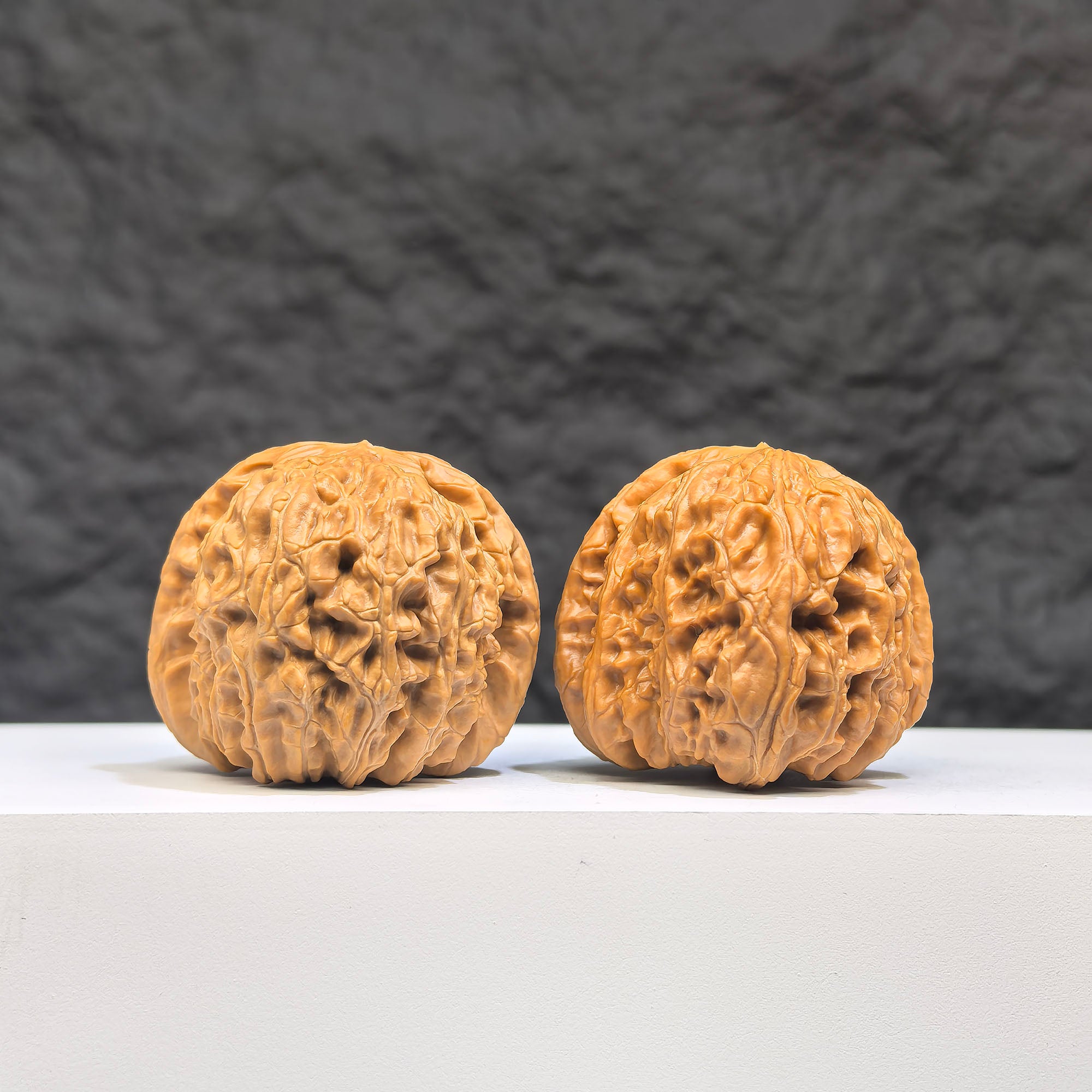 White Lion Wenwan Walnut pair by Wenwan Art, 37mm x 38mm, featuring detailed carvings and smooth polished surfaces.