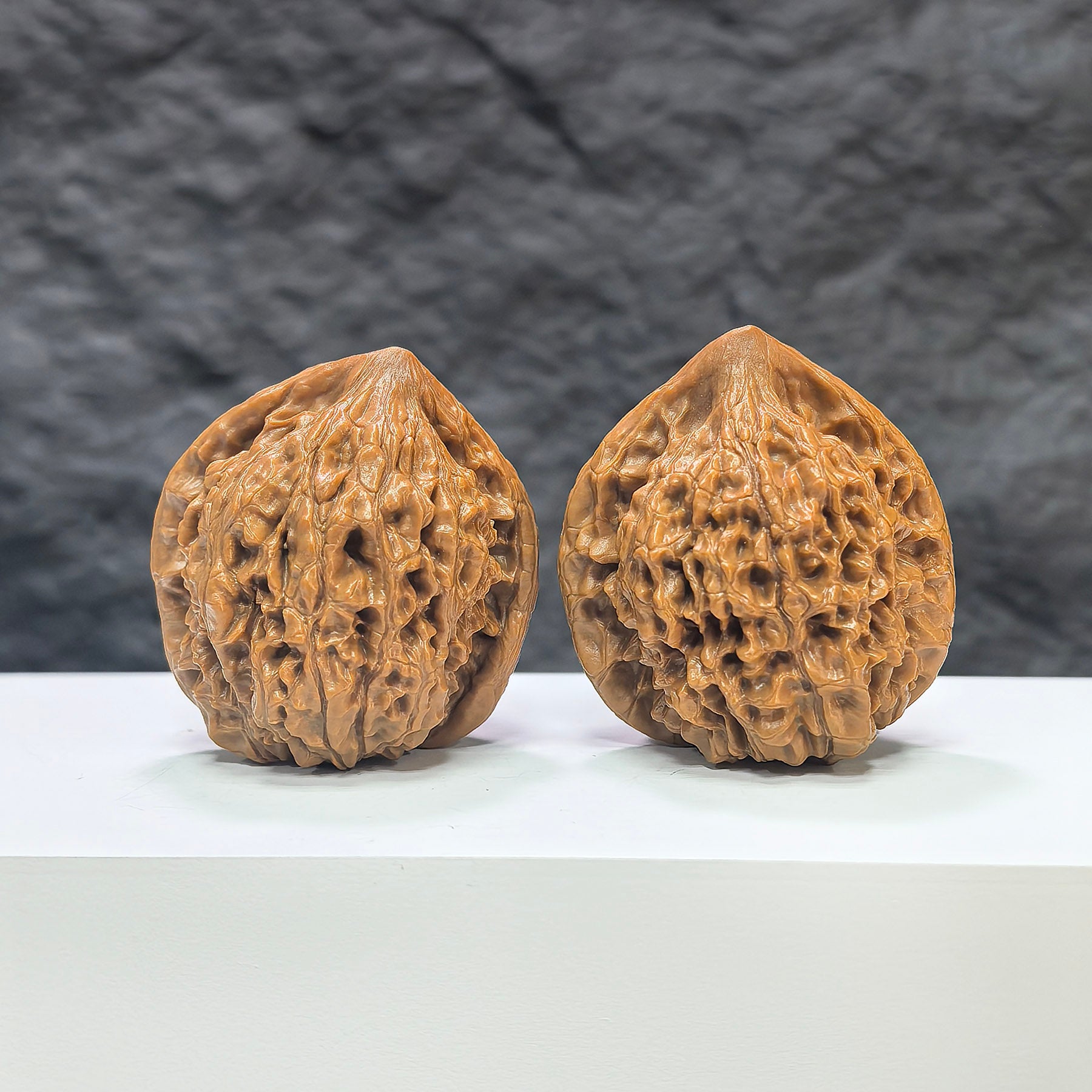 Pair of large Wenwan Art official Wenwan walnuts, 40mm x 36mm, showcasing the smooth, polished surface and natural walnut color.