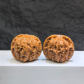 Pair of Wild Wolf Yelang Deep-Carved Wenwan Walnuts from Wenwan Art, 38mm x 36mm, featuring detailed natural wood carvings.