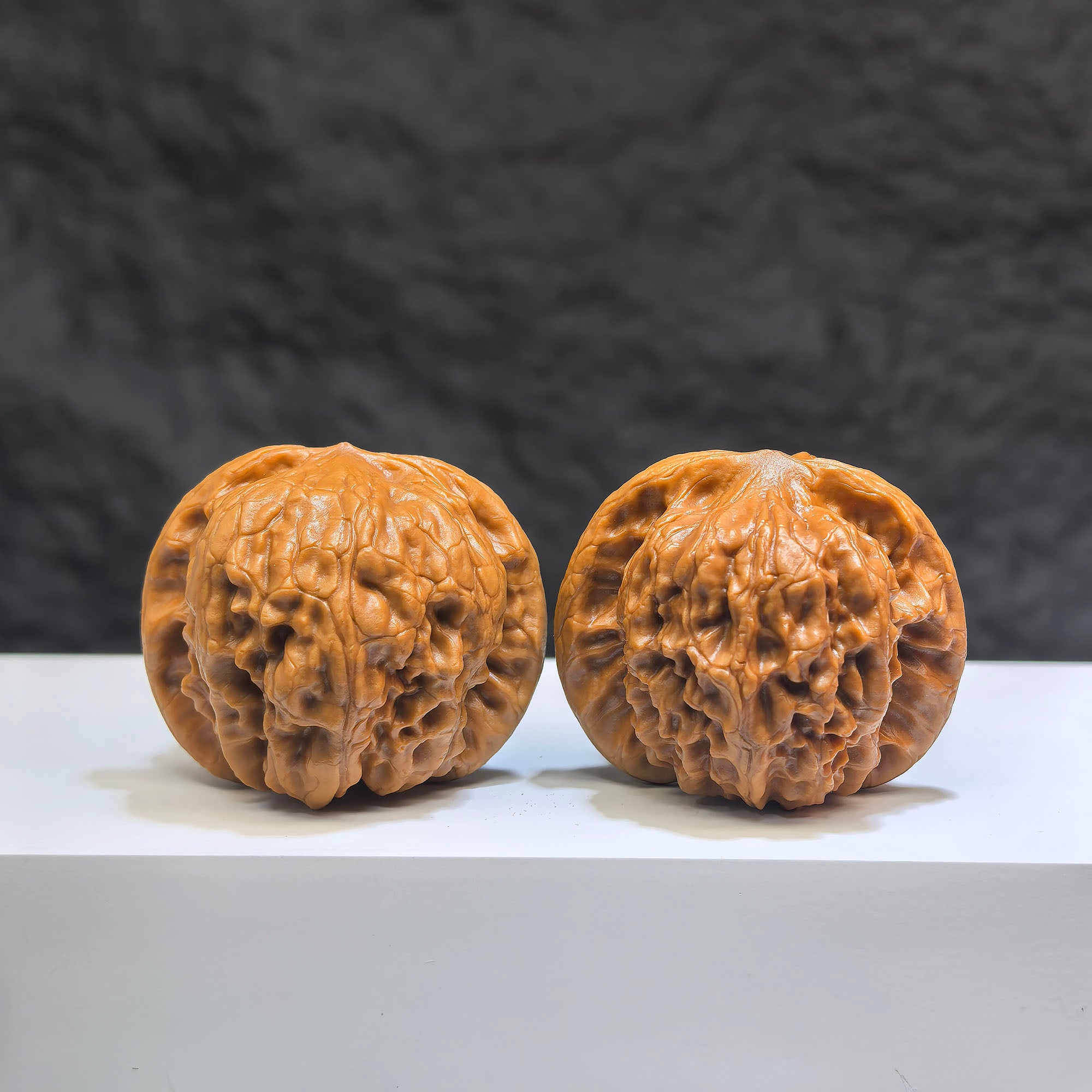 Pair of Wild Wolf Yelang Deep-Carved Wenwan Walnuts from Wenwan Art, 38mm x 36mm, featuring detailed natural wood carvings.