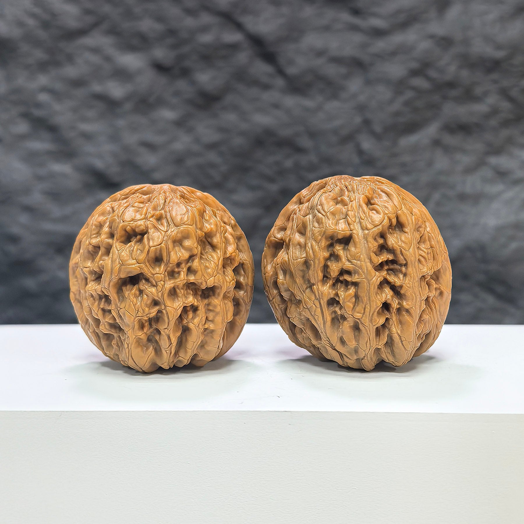 Pair of North China General Shoulder Wenwan walnuts by Wenwan Art, 40mm size, showcasing smooth, polished walnut surfaces with natural patterns.