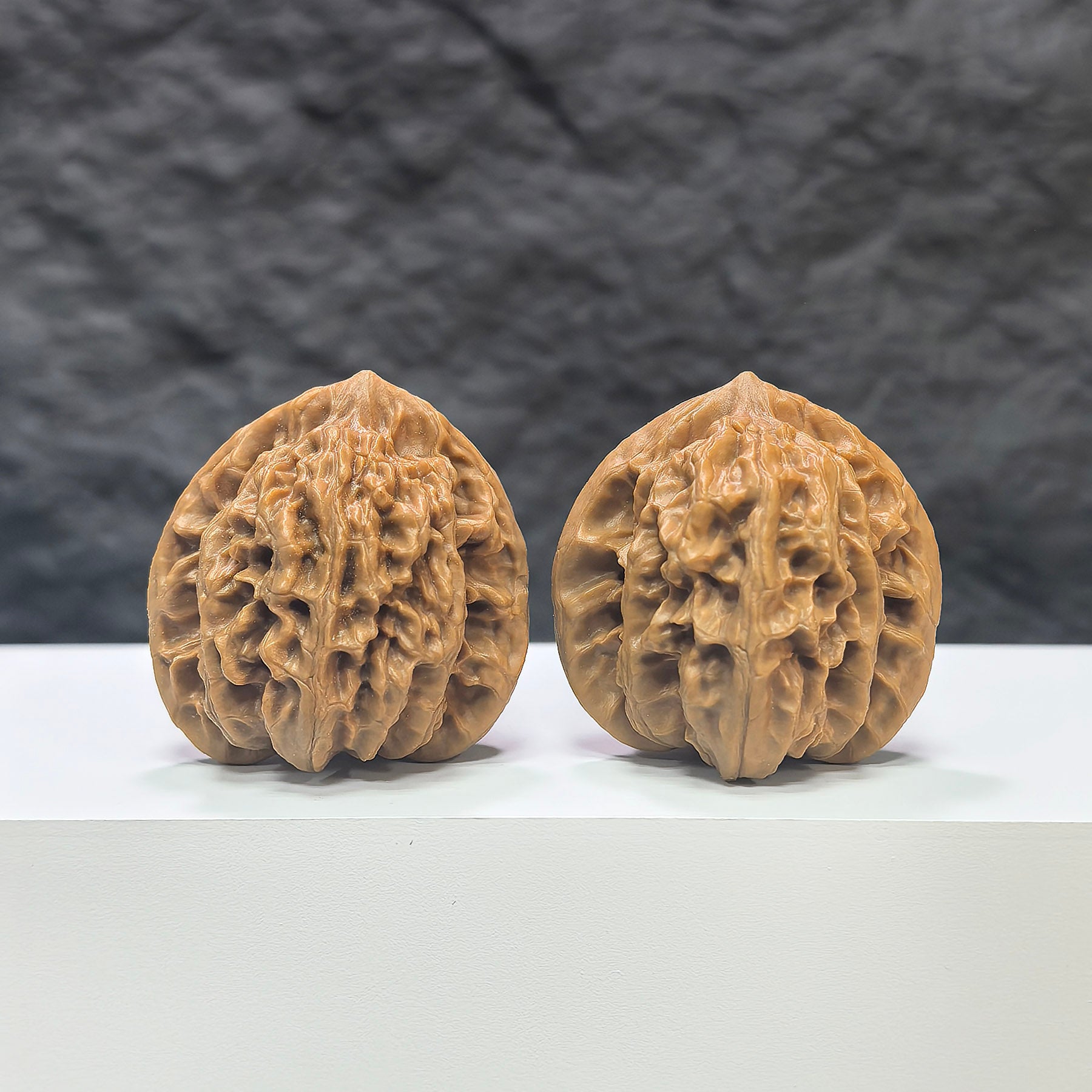 Pair of Peach Heart Xiayunling Wenwan walnuts from Wenwan Art, 38mm x 35mm, showcasing smooth, polished walnut with natural wood grain.