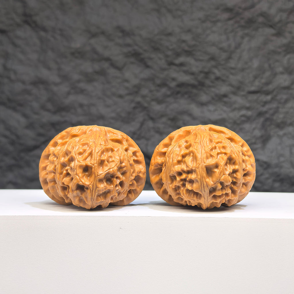 Pair of Palace Lantern Wenwan walnuts from Wenwan Art, featuring carved traditional designs, 42mm x 41mm, detailed and polished.