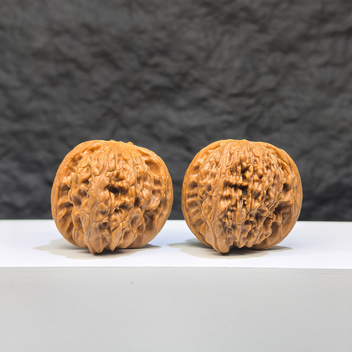Pair of Wild Millstone Wenwan walnuts by Wenwan Art, 36mm size, showcasing natural walnut shells with textured surface details.