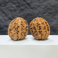 Wenwan Art classic North China General shoulder crippled foot Wenwan walnut pair, 39mm x 40mm, with detailed natural walnut grain.