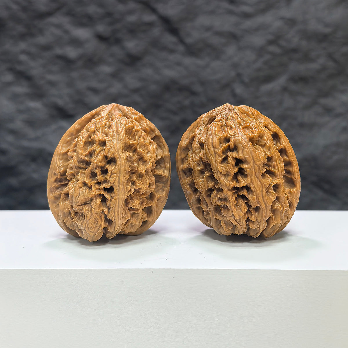 Wenwan Art classic North China General shoulder crippled foot Wenwan walnut pair, 39mm x 40mm, with detailed natural walnut grain.