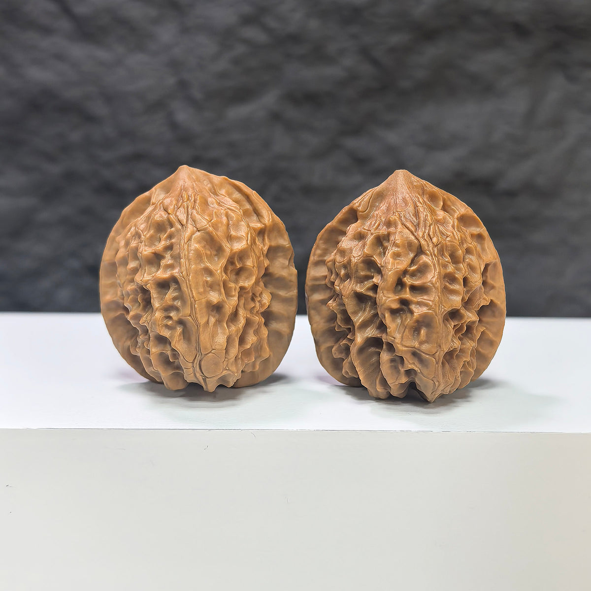Wenwan Art Linglong x White Snake Valley Classic Wenwan Walnut pair, 33mm x 35mm, detailed walnut carvings on natural wood.