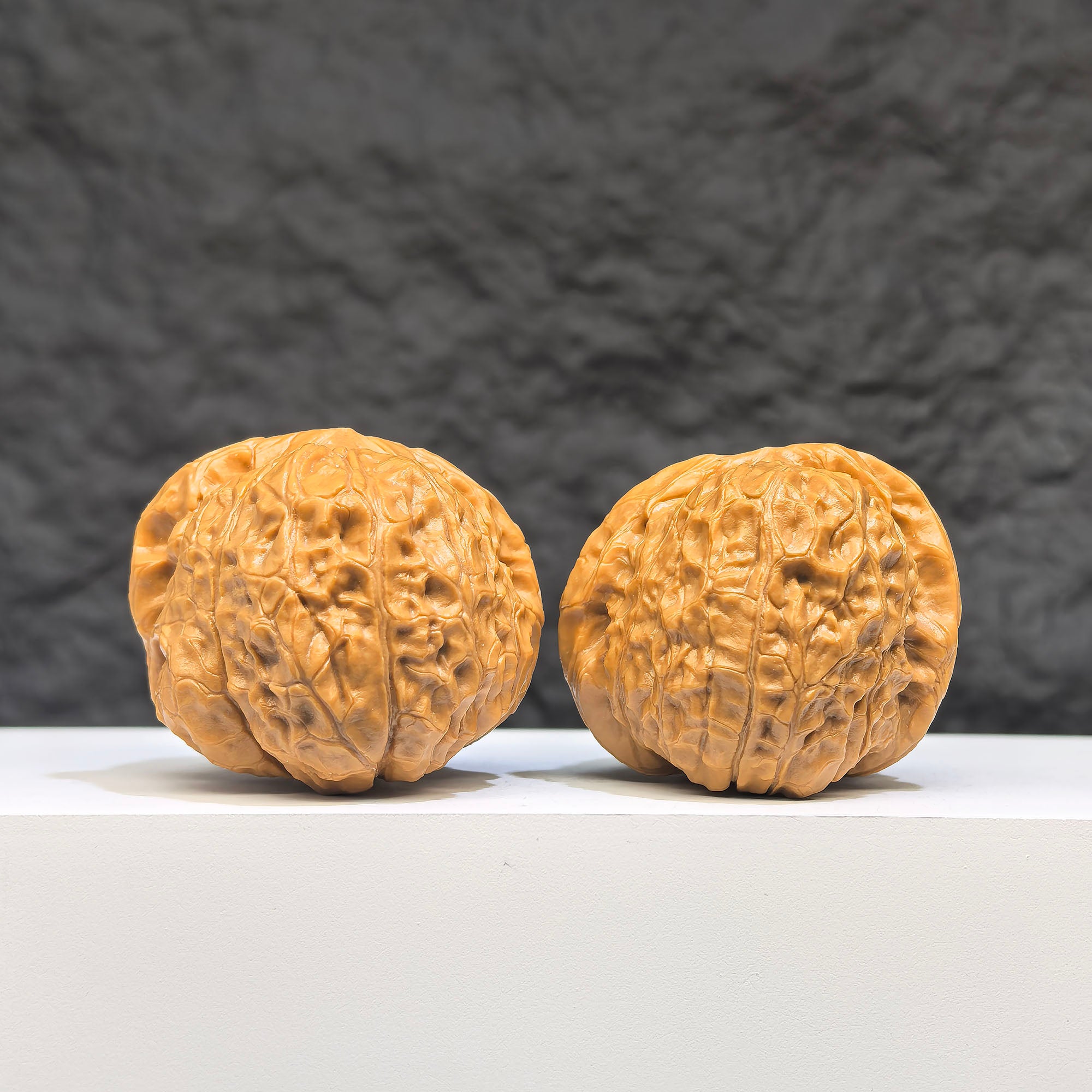 Pair of Pumpkin Pier Wenwan Walnuts from Wenwan Art, 40mm x 42mm, showcasing detailed carved pumpkin designs in natural walnut color.