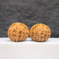 Pair of Palace Lantern Wenwan walnuts by Wenwan Art, 42mm x 40mm, featuring intricate carved designs on smooth walnut surfaces.
