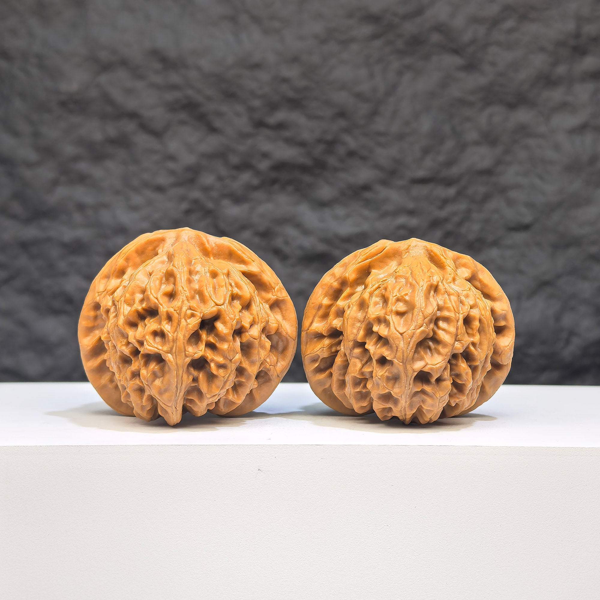 Pair of Palace Lantern Wenwan walnuts by Wenwan Art, 42mm x 40mm, featuring intricate carved designs on smooth walnut surfaces.