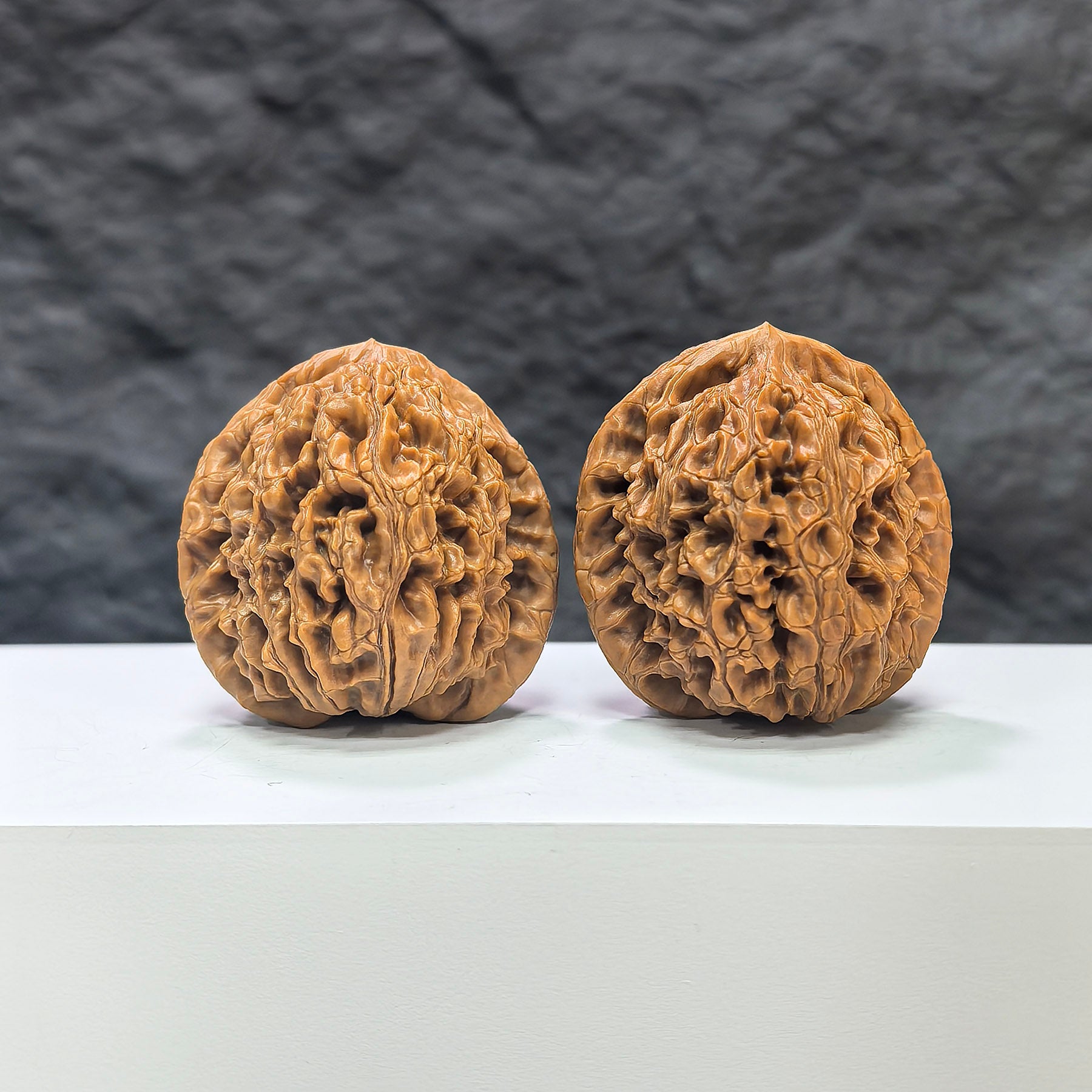 Pair of Water Dragon Texture Wenwan walnuts from Wenwan Art, featuring intricate water dragon patterns, measuring 40mm x 39mm.