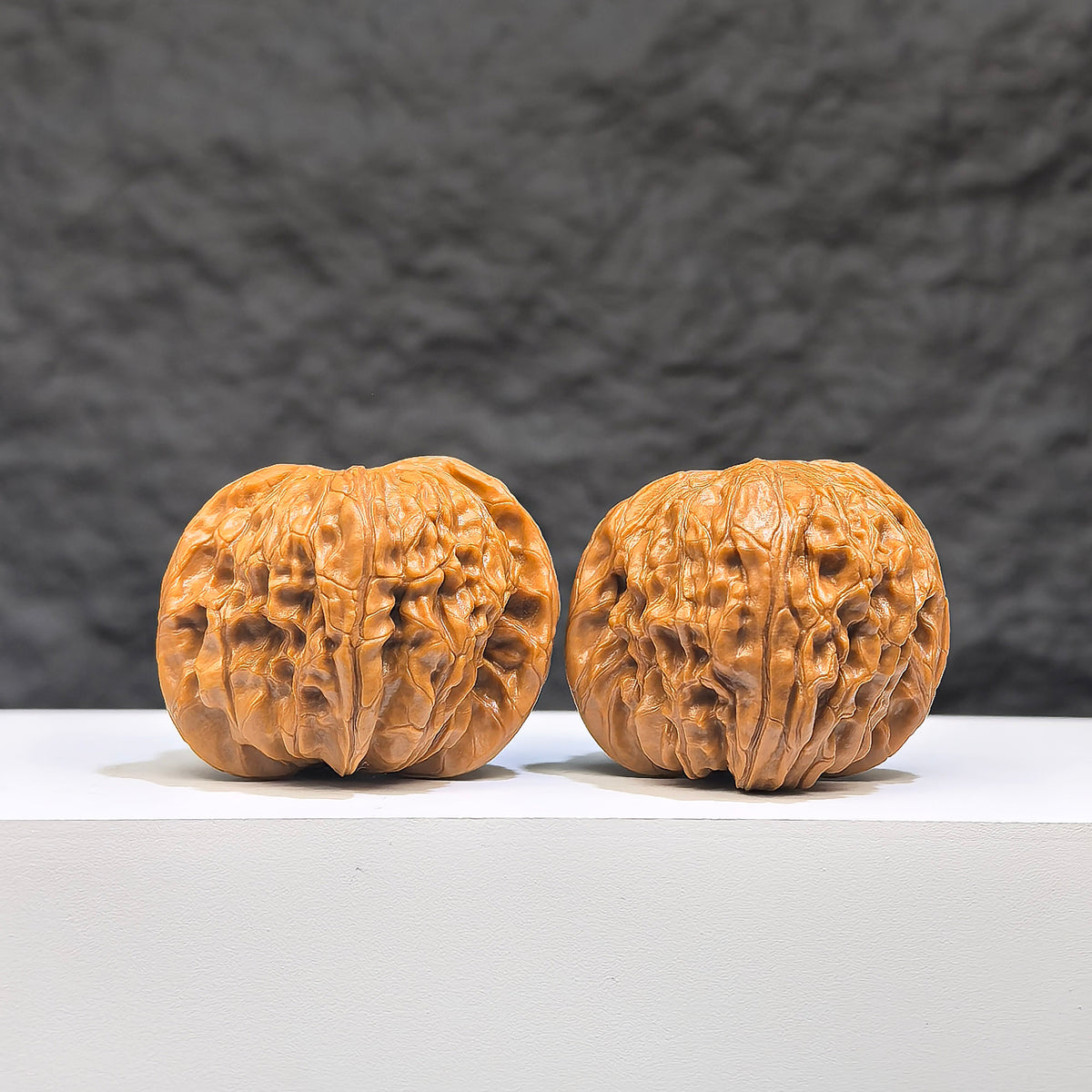 Red Shell Millstone Wenwan Walnut pair by Wenwan Art, featuring 39mm x 38mm classic Wenwan walnuts with red shells.